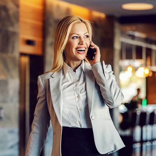 Happy,Businesswoman,On,A,Business,Trip,Walking,In,The,Hall EXECUTIVE HEALTH SOLUTIONS FOR A THRIVING WORKFORCE